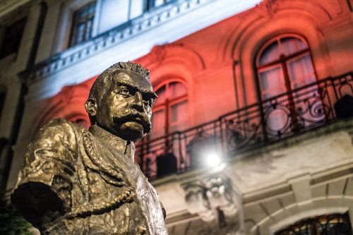 White & red illumination and Pilsudski monument in Brussels.